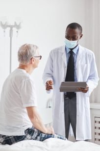 african-american-doctor-consulting-senior-man-in-h-2021-09-24-04-17-13-utc-Custom-e1644549956675.jpg